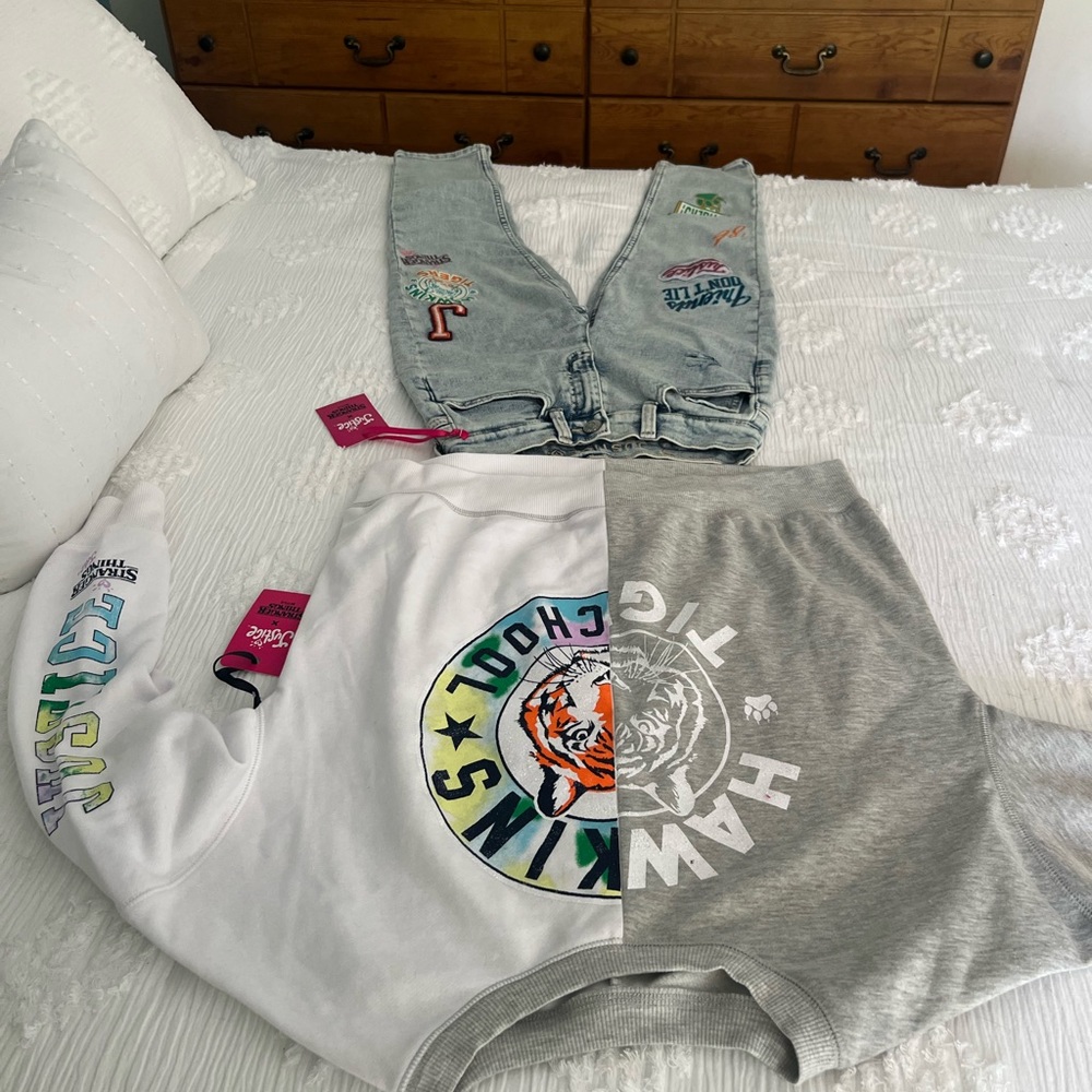 A pair of STRANGER THINGS jeans & Sweat Shirt Brand new with Tags size 12 & med